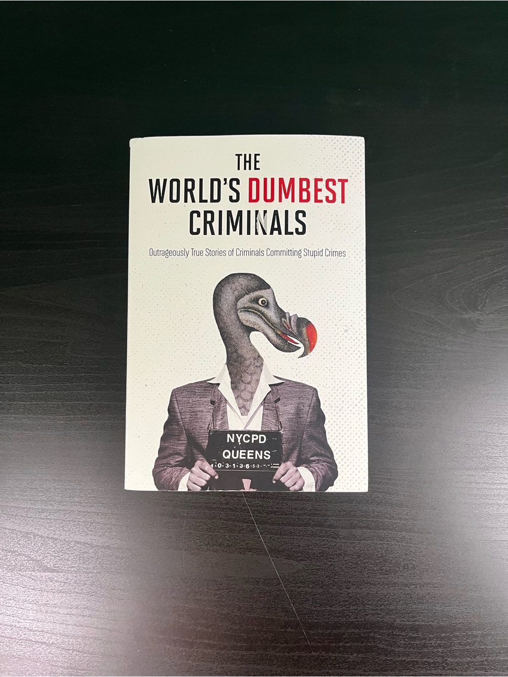 The World's Dumbest Criminals Book — White Cover with Red Accent